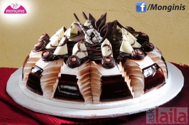 Monginis Cake Shop - Thane - This is a cake which one would desire for  their exclusive wedding celebration! Decorated with silver pearls, flowers  and leaves the cake looks extremely rich and